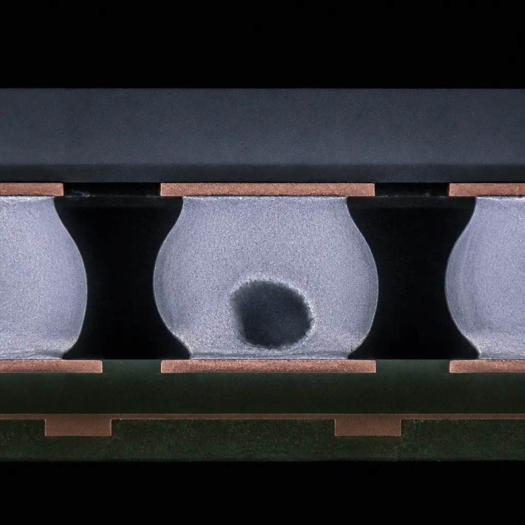 Photorealistic 3D render of a BGA solder joint cross-section under X-ray — individual solder balls visible between package substrate and PCB, one joint showing excessive voiding, industrial blue-grey tones with copper pad detail